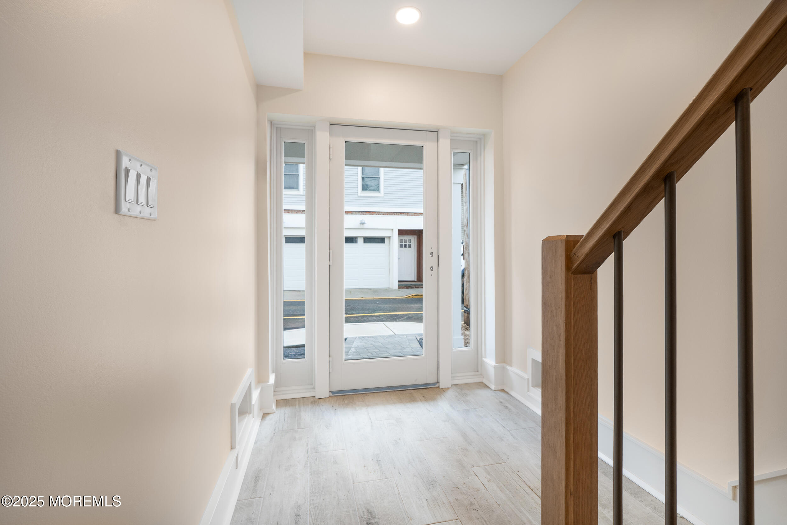 7 South Street Sea Bright, NJ 07760 - Photo 9 of 45 a view of a hallway with wooden floor and entryway