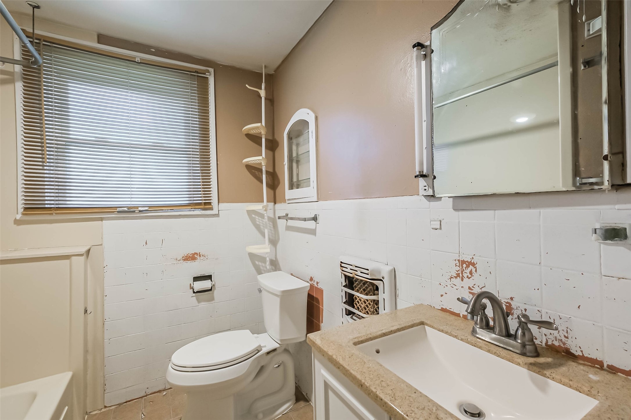 2802 Wheeler Avenue Houston, TX 77004 - Photo 11 of 20 a bathroom with a sink a toilet and a mirror