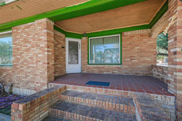 a view of front door of house with stairs