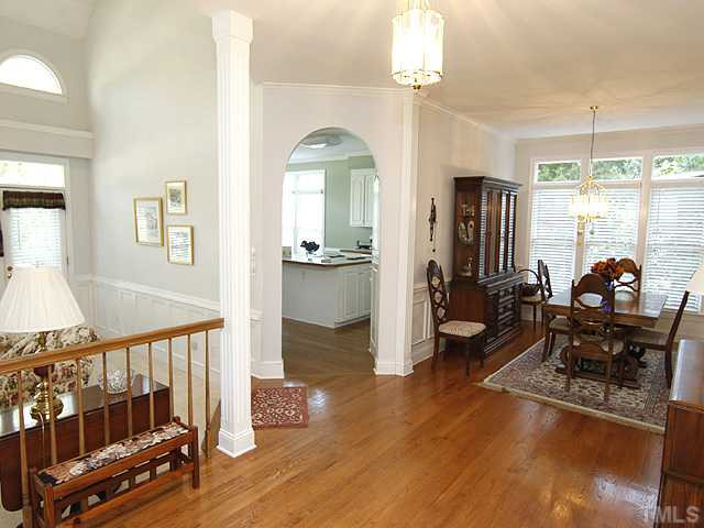 2964 Tillinghast Trail Raleigh, NC 27613 - Photo 8 of 23 Nice entry foyer with hardwoods welcomes you.Wainscoting and chair rail in dining room and family room. Foyer
