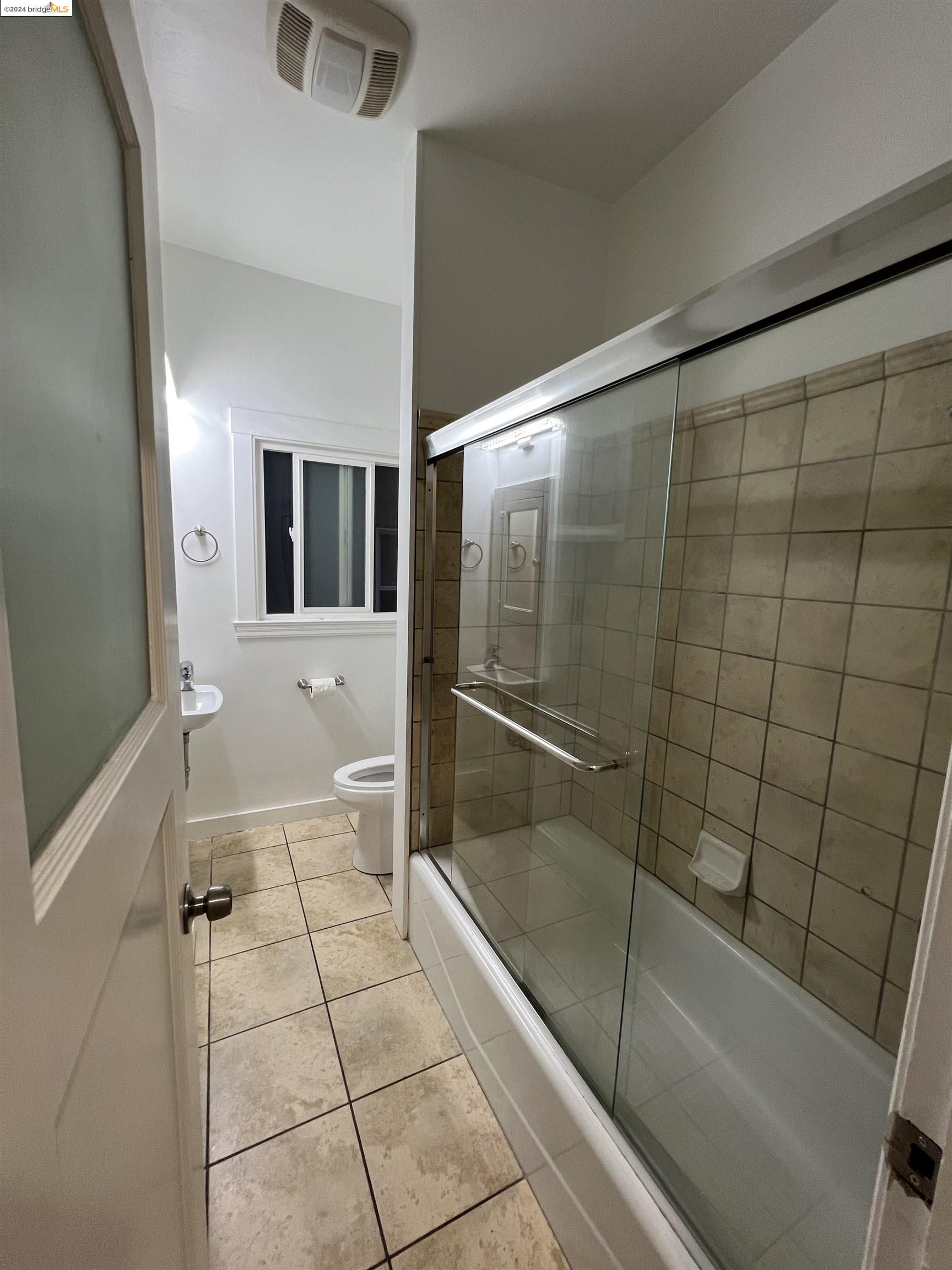 1846 Spruce Street, Unit 4 Berkeley, CA 94709 - Photo 4 of 6 a bathroom with a bathtub and shower