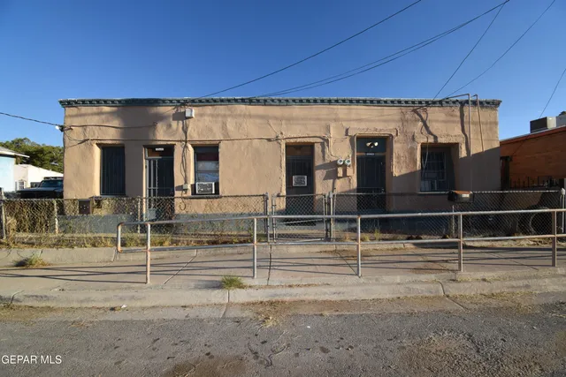 a view of a house with a street