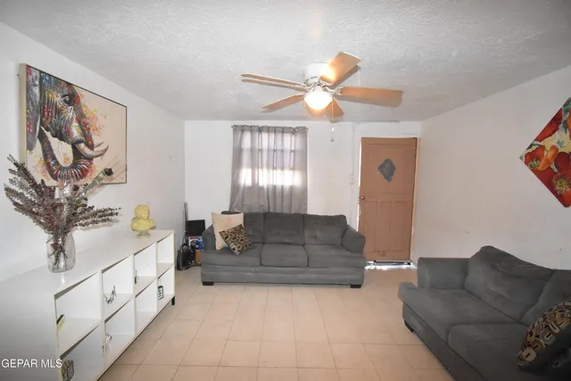 a kitchen with stainless steel appliances granite countertop a stove and a refrigerator