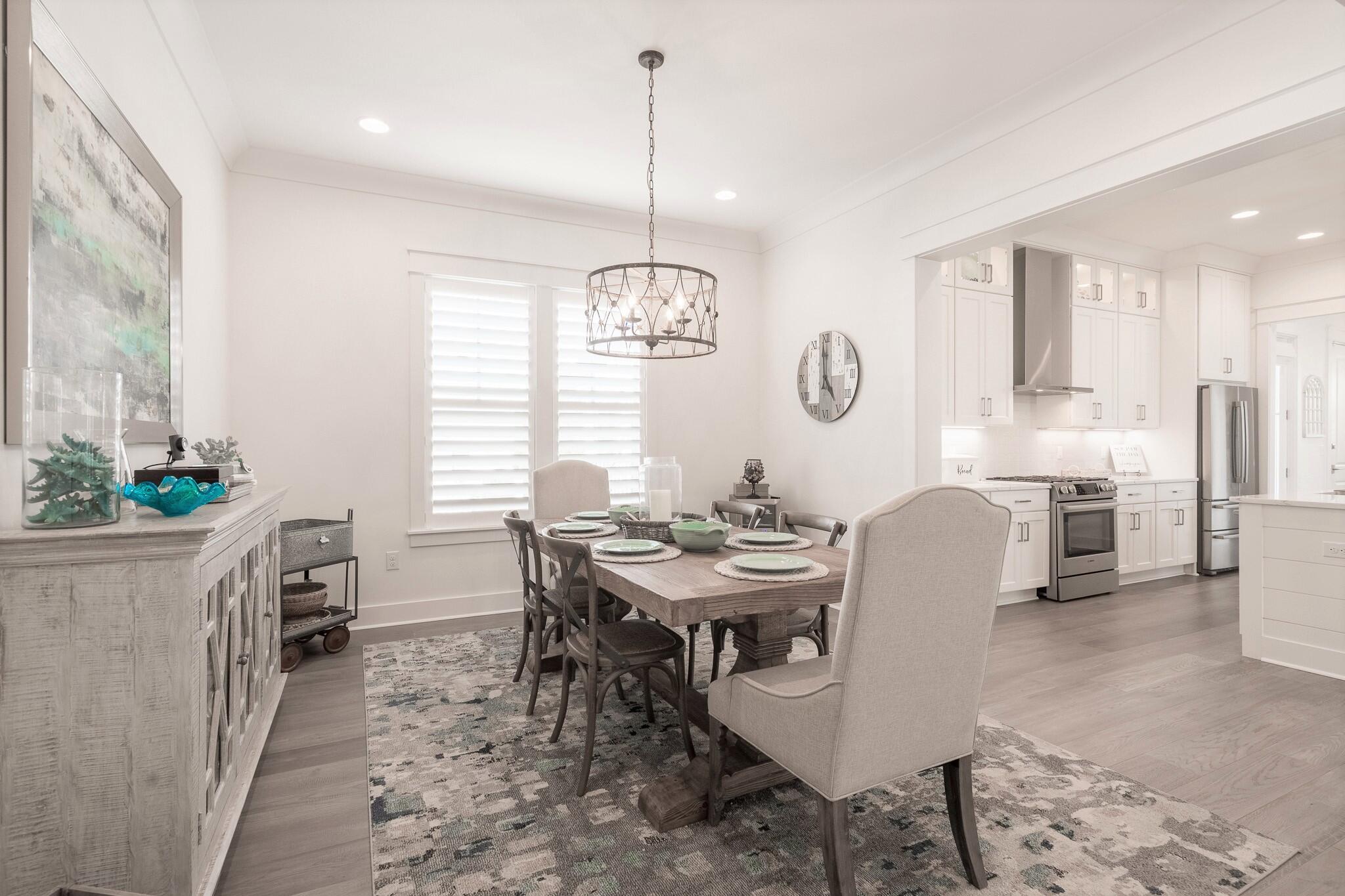229 Sandchase Circle Inlet Beach, FL 32461 - Photo 11 of 61 a view of a dining room with furniture window and wooden floor
