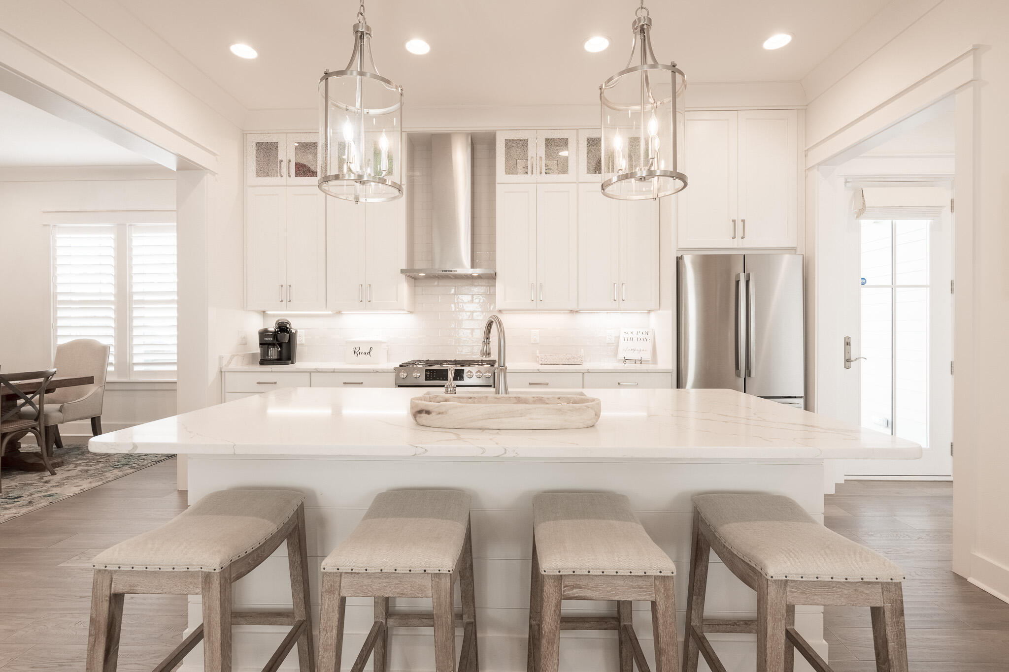 229 Sandchase Circle Inlet Beach, FL 32461 - Photo 14 of 61 a kitchen with stainless steel appliances kitchen island granite countertop a sink and cabinets