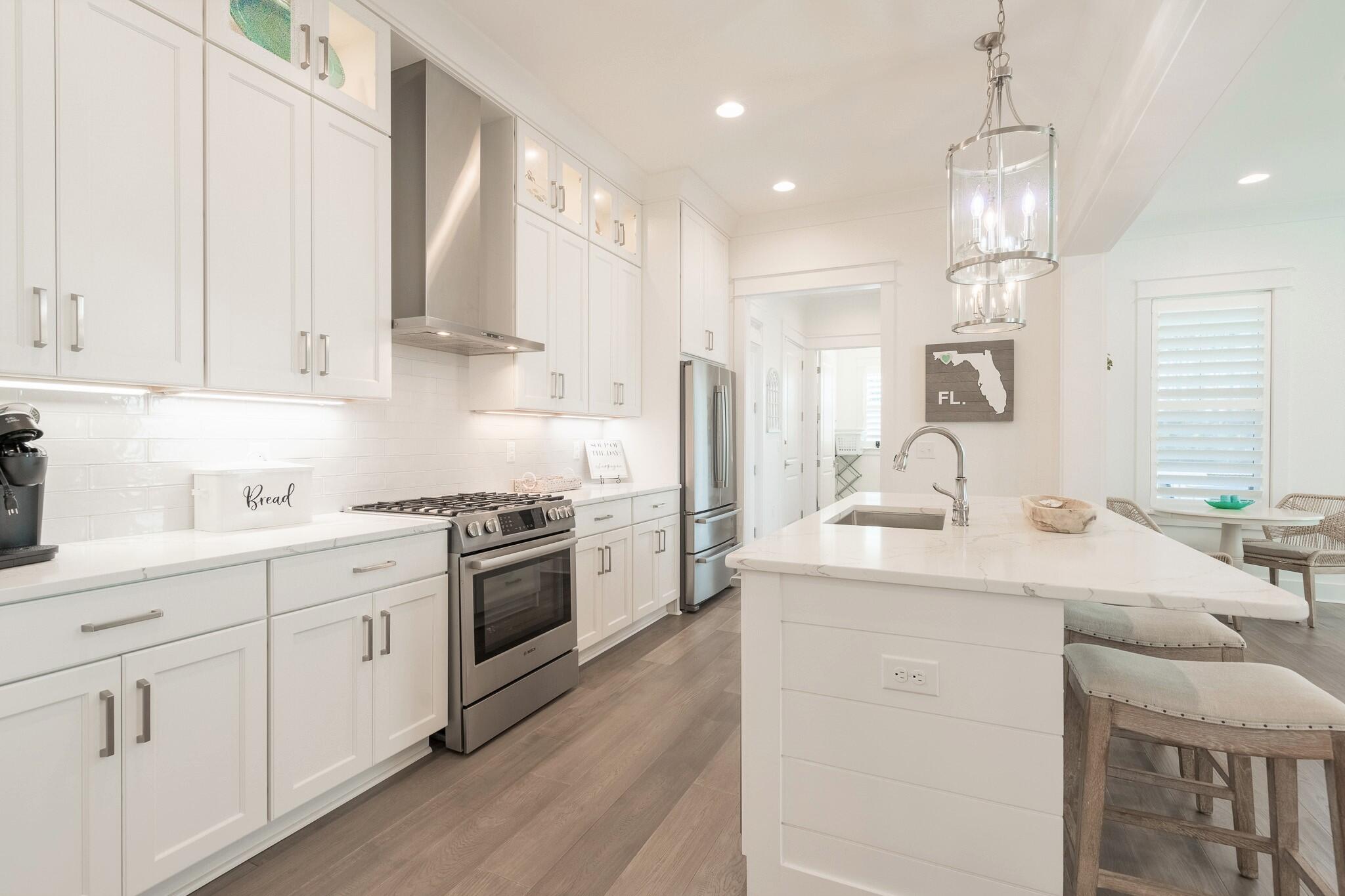 229 Sandchase Circle Inlet Beach, FL 32461 - Photo 15 of 61 a kitchen with a sink stove and cabinets