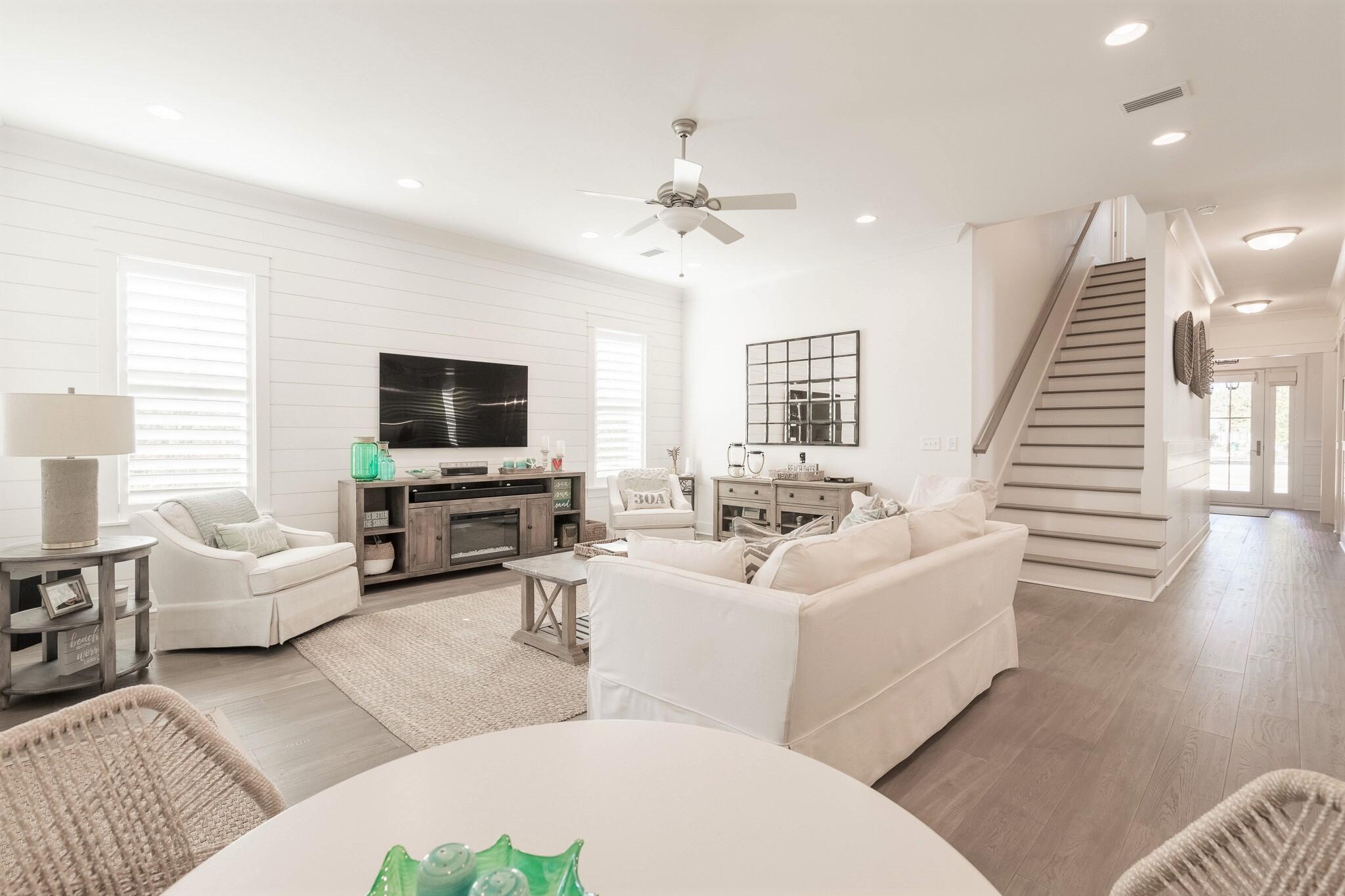 229 Sandchase Circle Inlet Beach, FL 32461 - Photo 18 of 61 a living room with furniture and a flat screen tv
