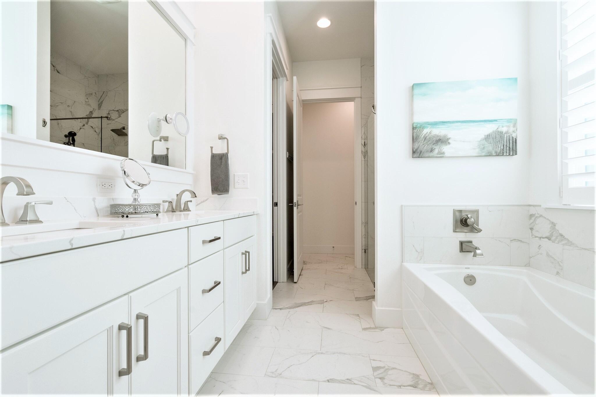 229 Sandchase Circle Inlet Beach, FL 32461 - Photo 21 of 61 a bathroom with a tub sink and mirror