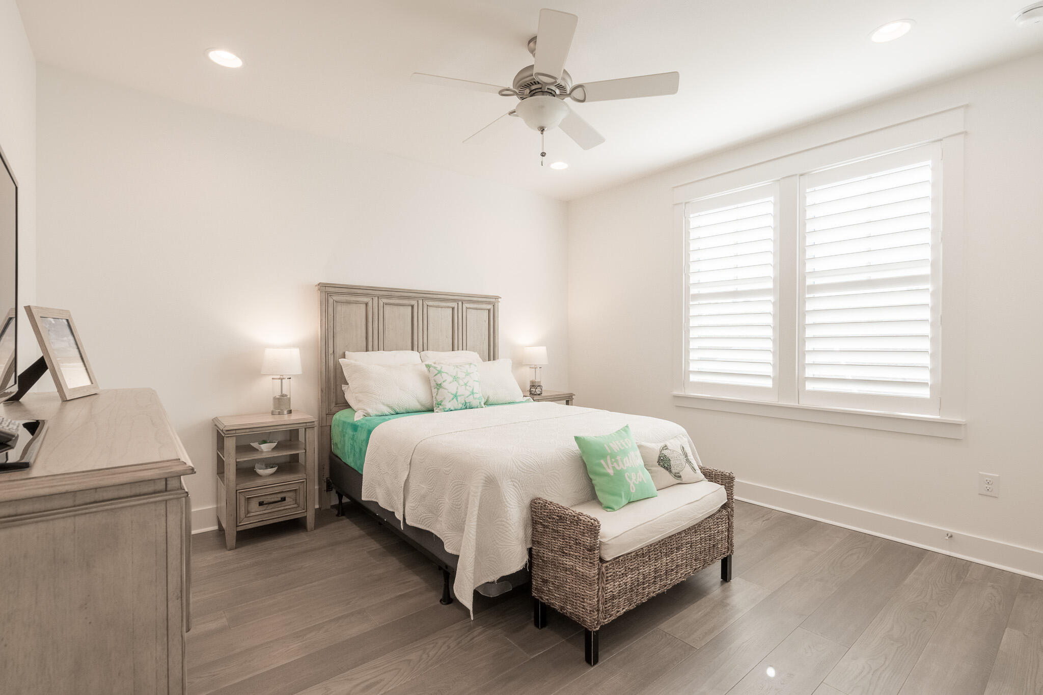 229 Sandchase Circle Inlet Beach, FL 32461 - Photo 30 of 61 a bedroom with a bed and a chandelier