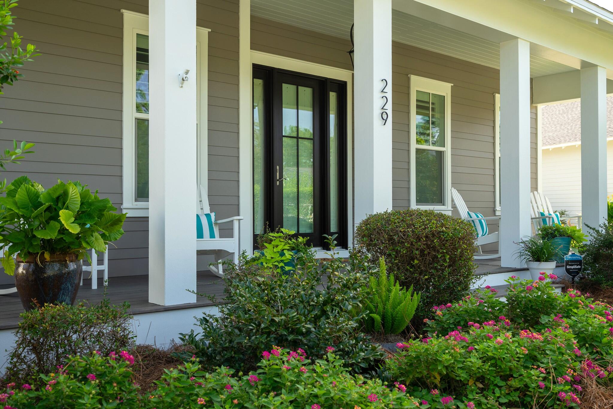 229 Sandchase Circle Inlet Beach, FL 32461 - Photo 3 of 61 a view of a backyard with potted plants