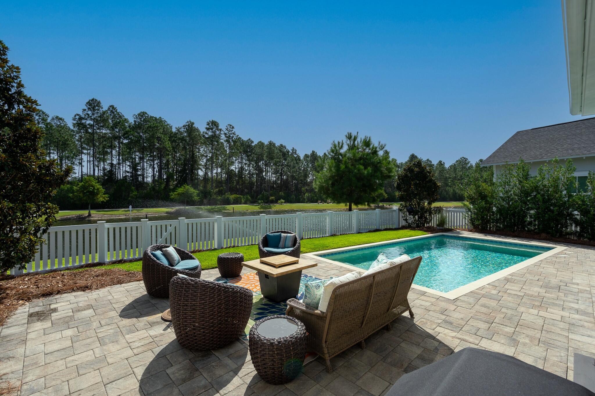 229 Sandchase Circle Inlet Beach, FL 32461 - Photo 39 of 61 a view of swimming pool with couches in the patio