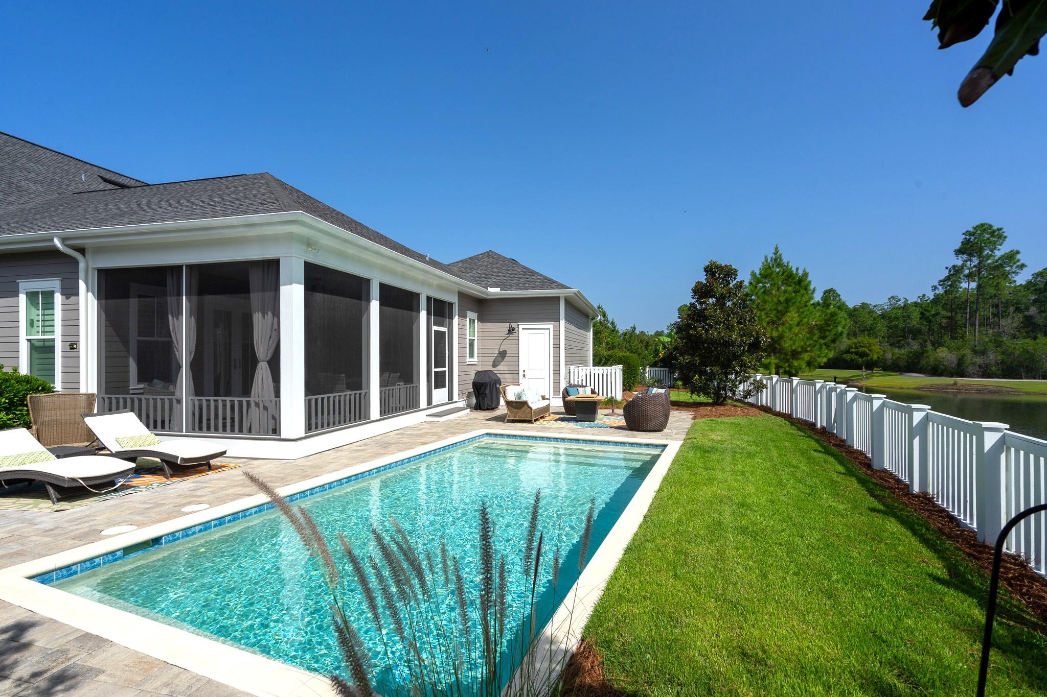 229 Sandchase Circle Inlet Beach, FL 32461 - Photo 41 of 61 a view of a house with swimming pool and porch