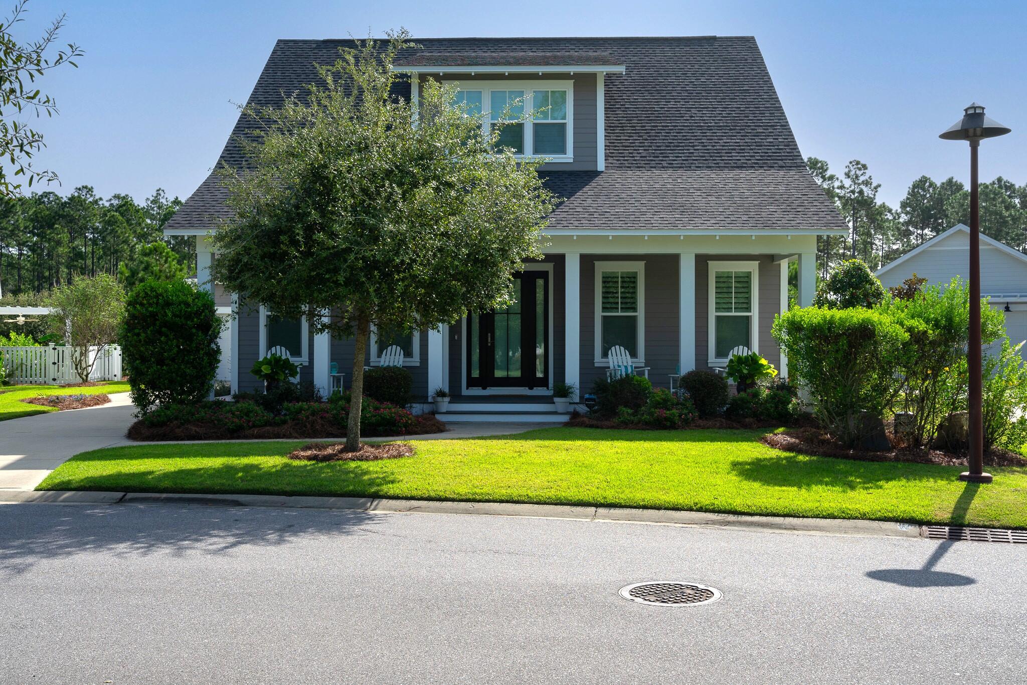 229 Sandchase Circle Inlet Beach, FL 32461 - Photo 5 of 61 a view of a house with a yard and plants