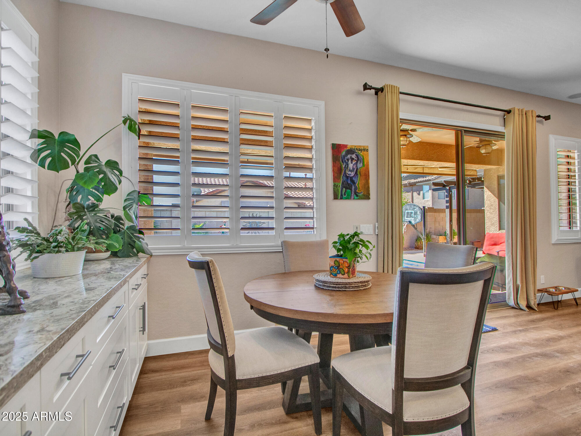6919 West Rowel Road Peoria, AZ 85383 - Photo 25 of 74 a view of a dining room with furniture and window
