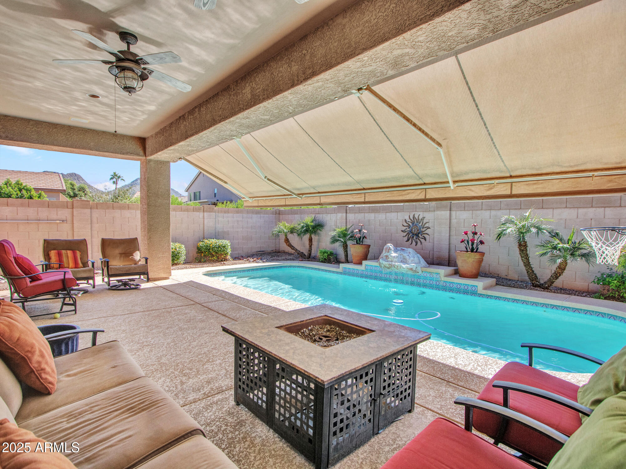 6919 West Rowel Road Peoria, AZ 85383 - Photo 34 of 74 a living room with a couch and a table
