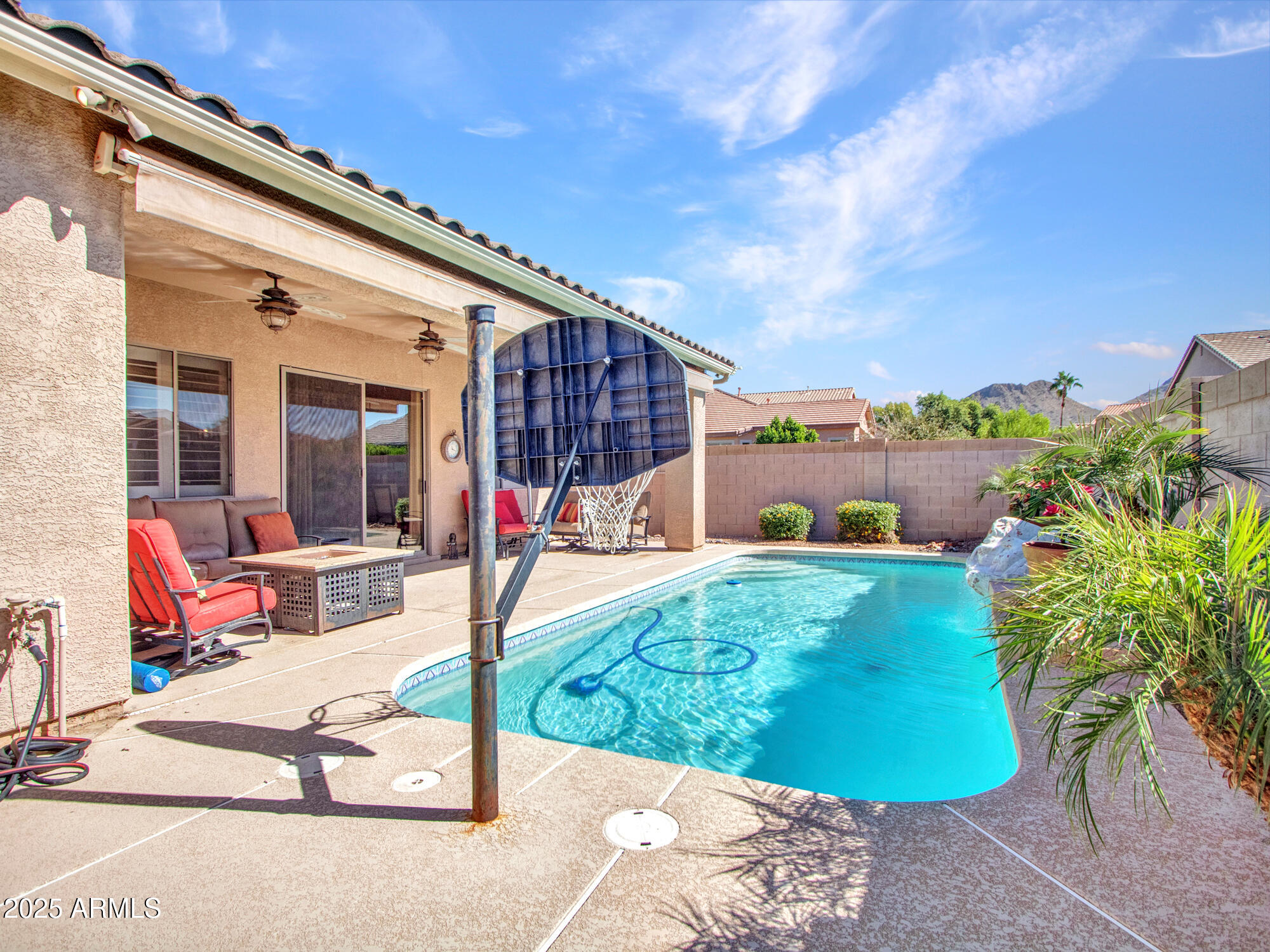 6919 West Rowel Road Peoria, AZ 85383 - Photo 39 of 74 a view of a patio with a table and chairs