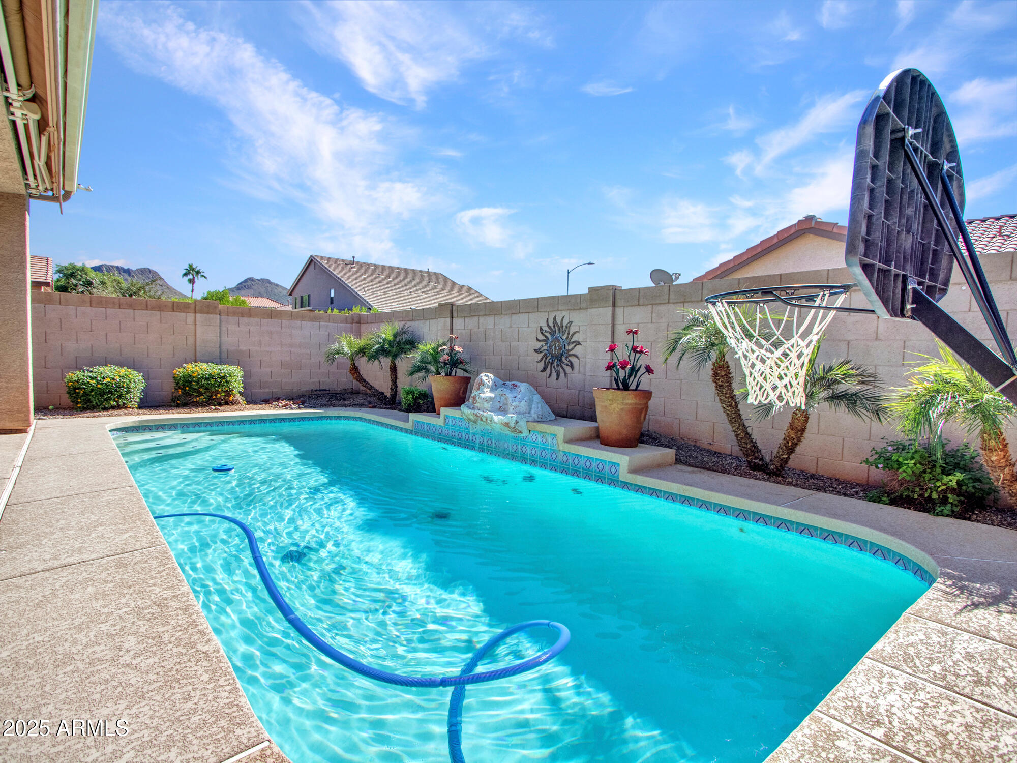 6919 West Rowel Road Peoria, AZ 85383 - Photo 42 of 74 a backyard of a house with table and chairs