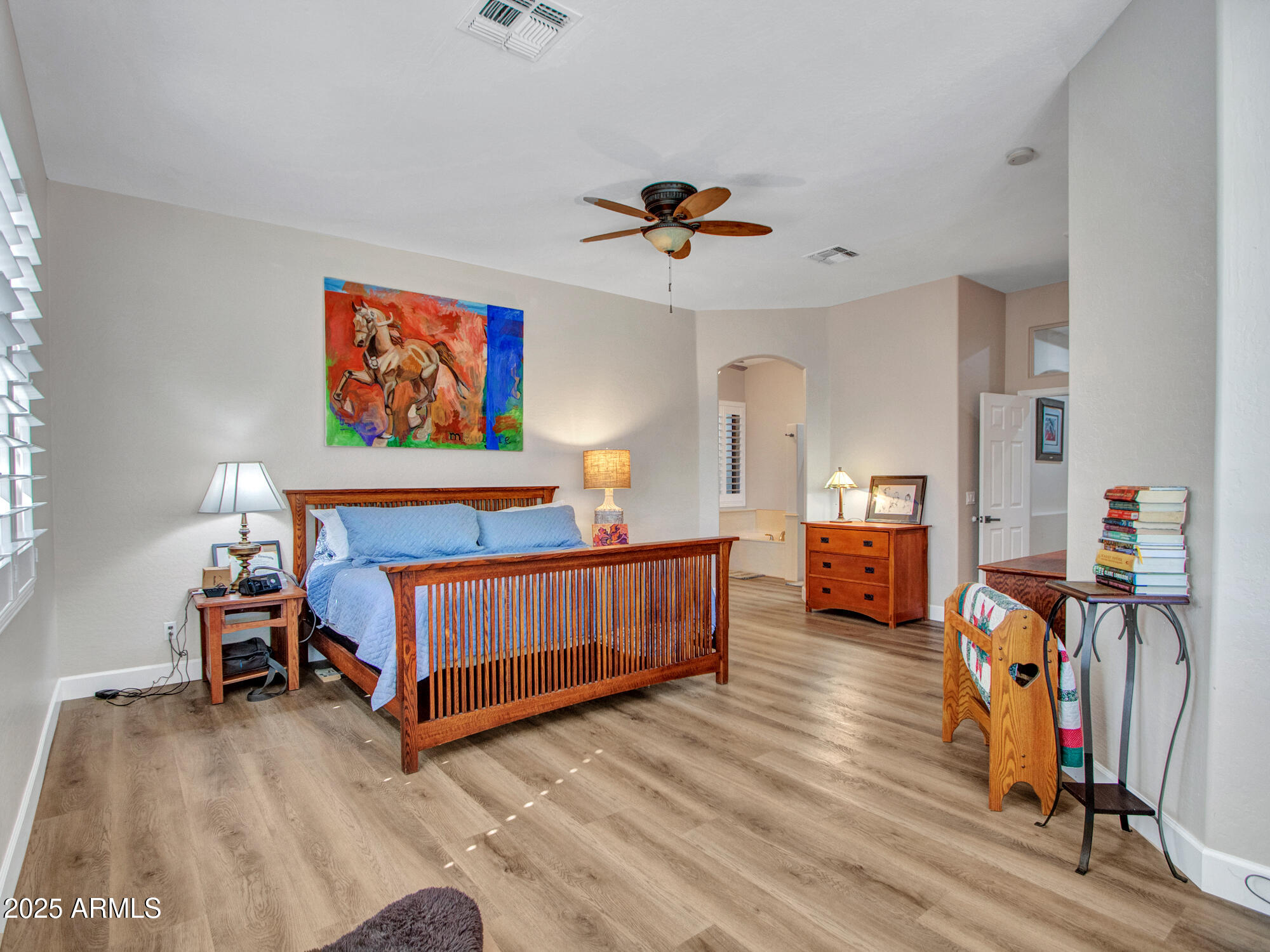 6919 West Rowel Road Peoria, AZ 85383 - Photo 47 of 74 a view of room with furniture and wooden floor