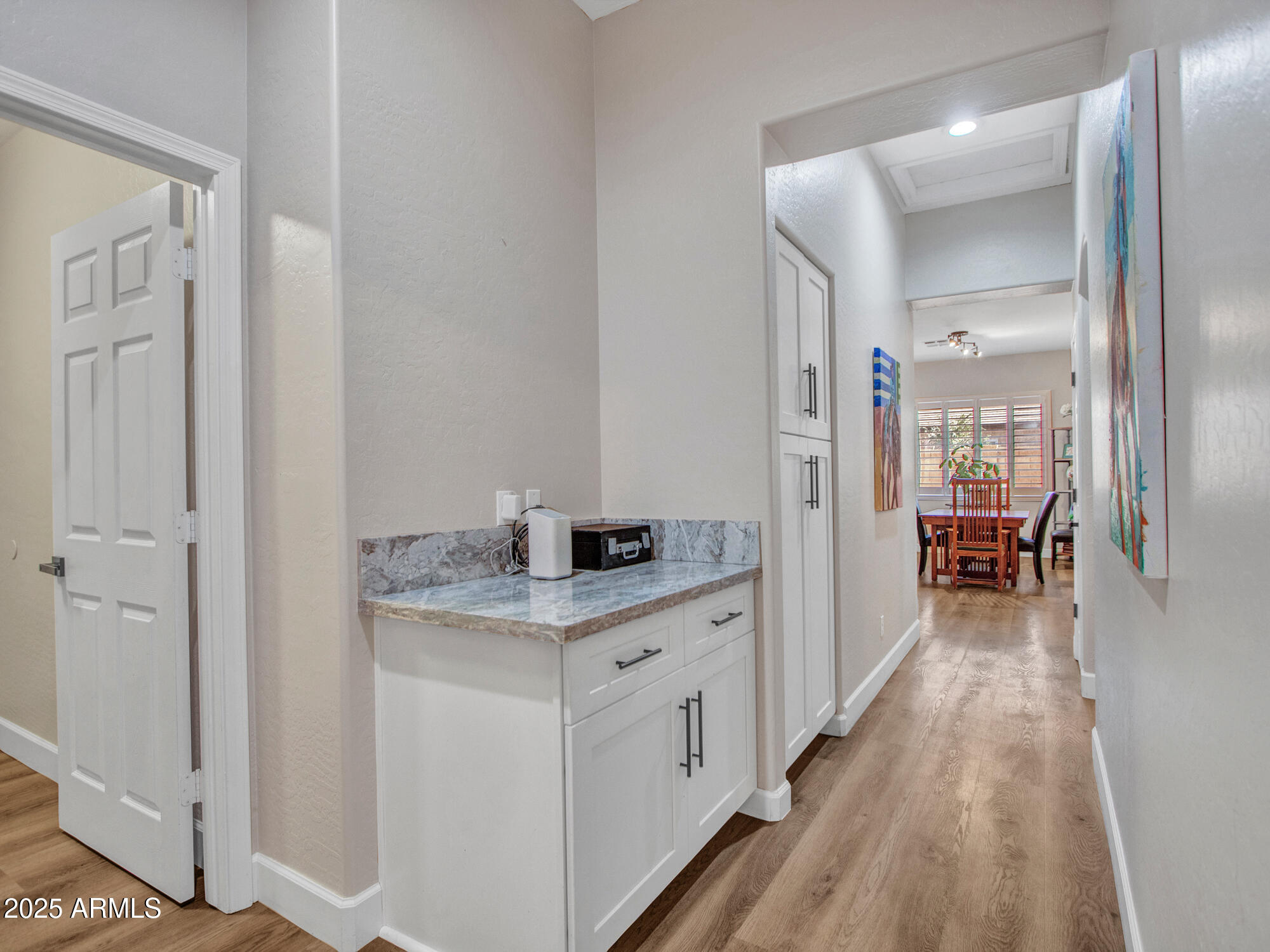 6919 West Rowel Road Peoria, AZ 85383 - Photo 51 of 74 a view of a kitchen from the hallway