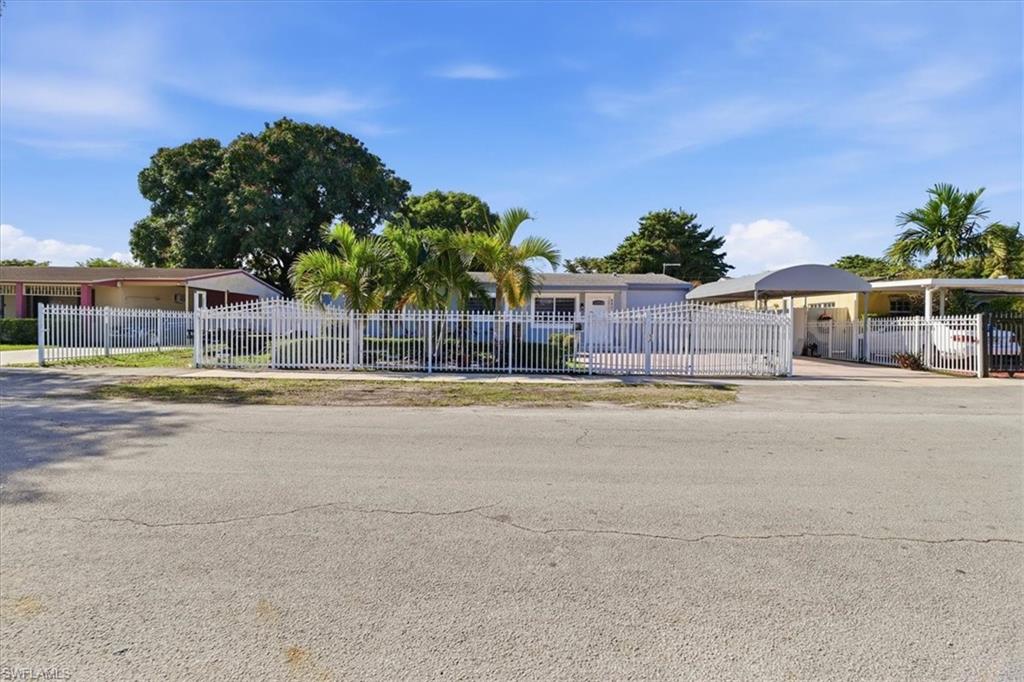 6800 Northwest 28th Avenue Miami, FL 33147 - Photo 1 of 40 Ranch-style house with a fenced front yard