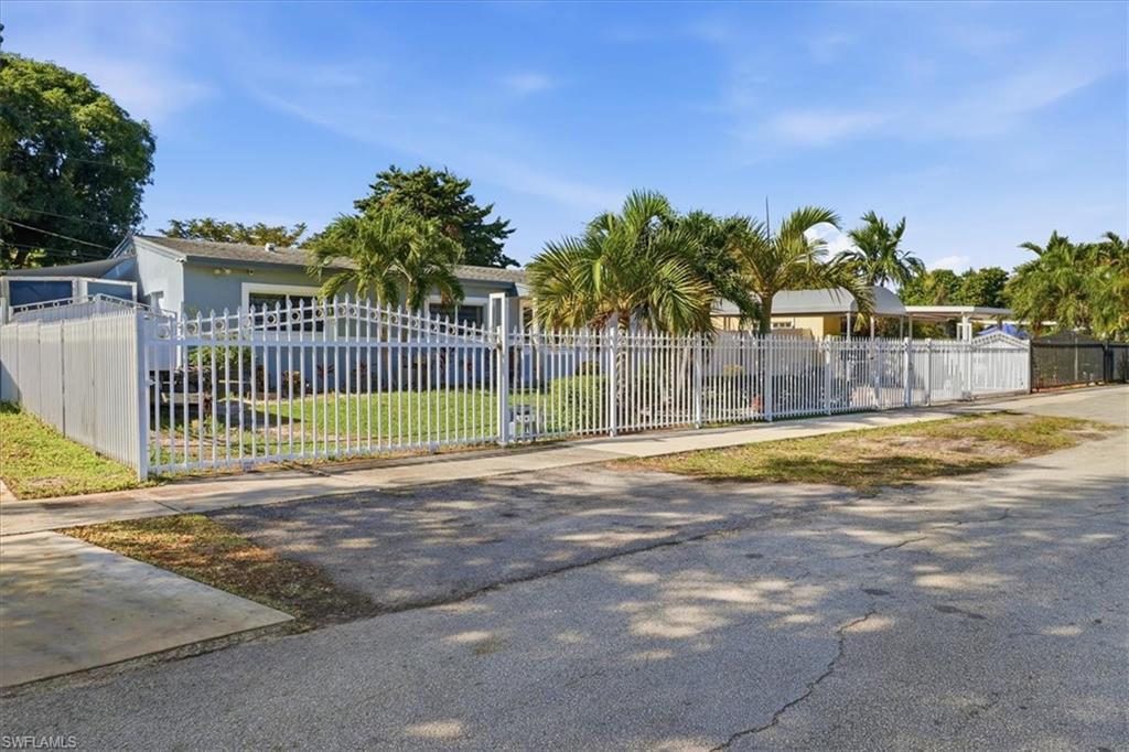 6800 Northwest 28th Avenue Miami, FL 33147 - Photo 2 of 40 Gate with a fenced front yard