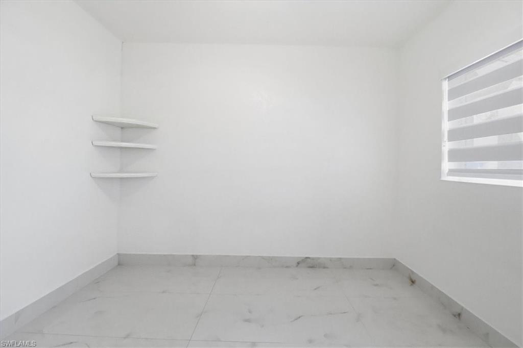 6800 Northwest 28th Avenue Miami, FL 33147 - Photo 22 of 40 Empty room with light marble finish floors