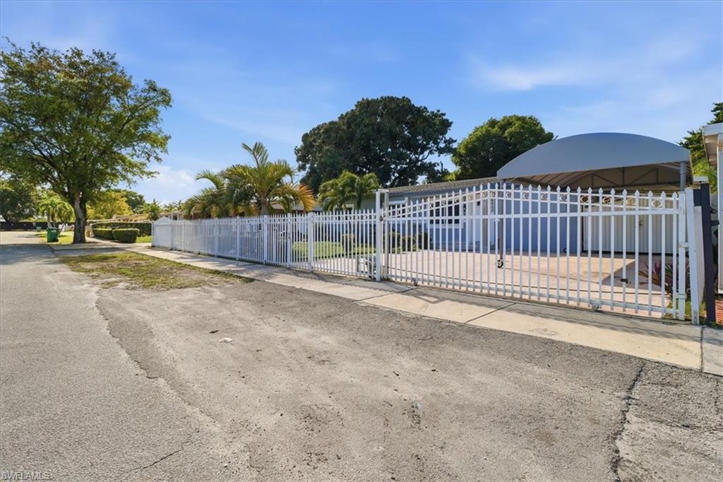 6800 Northwest 28th Avenue Miami, FL 33147 - Photo 3 of 40 Gate with a fenced front yard