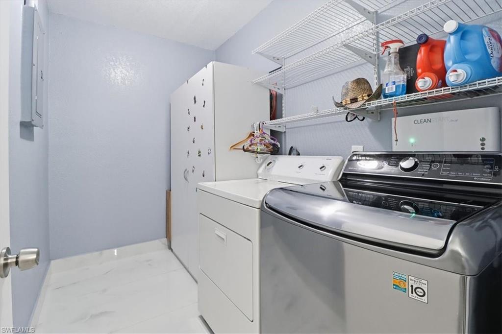 6800 Northwest 28th Avenue Miami, FL 33147 - Photo 30 of 40 Laundry room featuring separate washer and dryer and electric panel