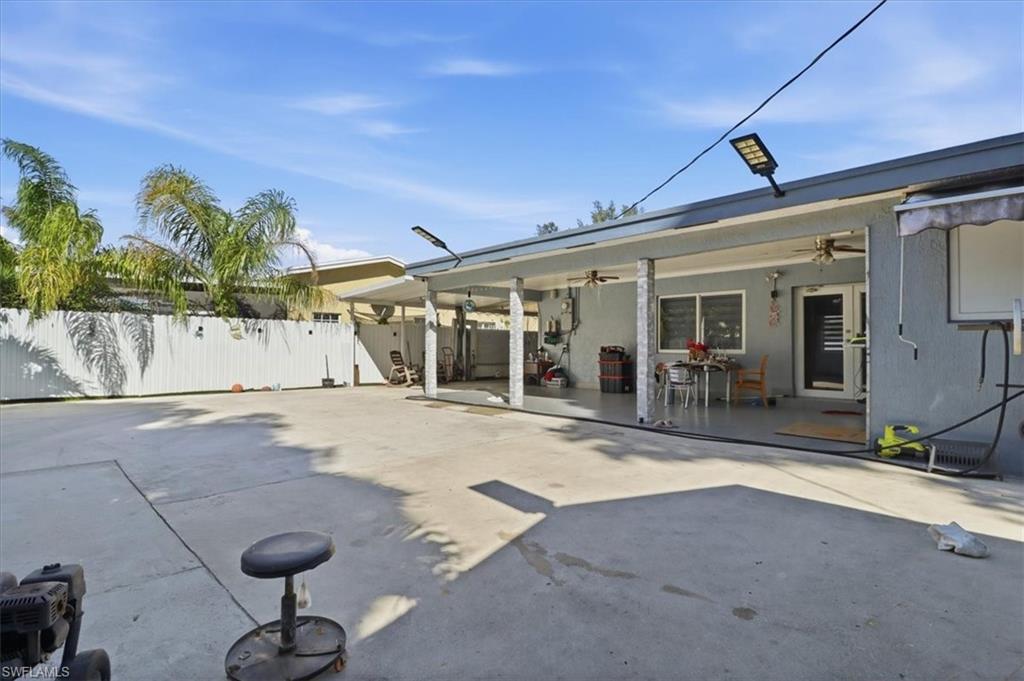 6800 Northwest 28th Avenue Miami, FL 33147 - Photo 35 of 40 Rear view of house with a ceiling fan and a patio area