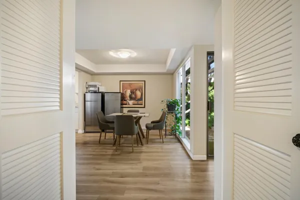 a view of a patio with table and chairs and potted plants