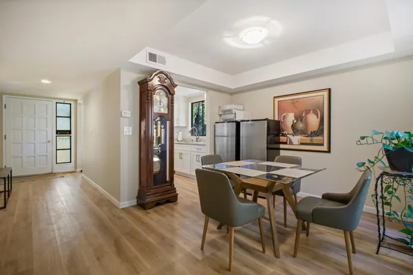 a view of a dining room with furniture and window