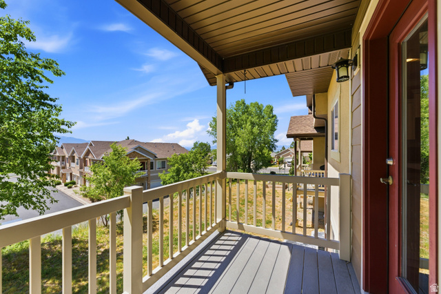 1614 Aspen Loop Provo, UT 84606 - Photo 39 of 47 Covered balcony featuring composite decking and a painted wood railing
