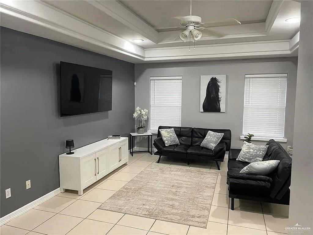 1909 Buffalo Avenue San Juan, TX 78589 - Photo 2 of 4 a living room with furniture and a flat screen tv