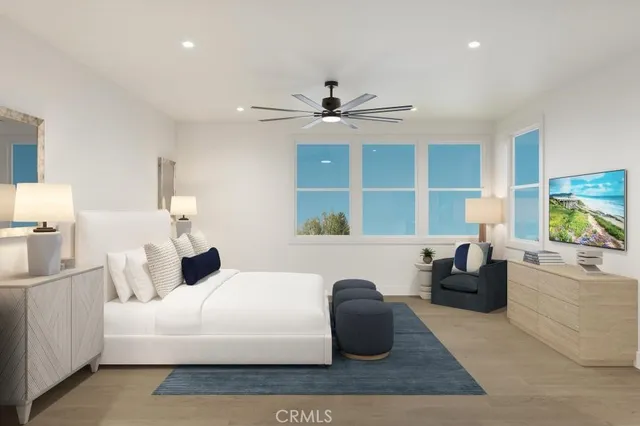 a living room with furniture a window and a chandelier
