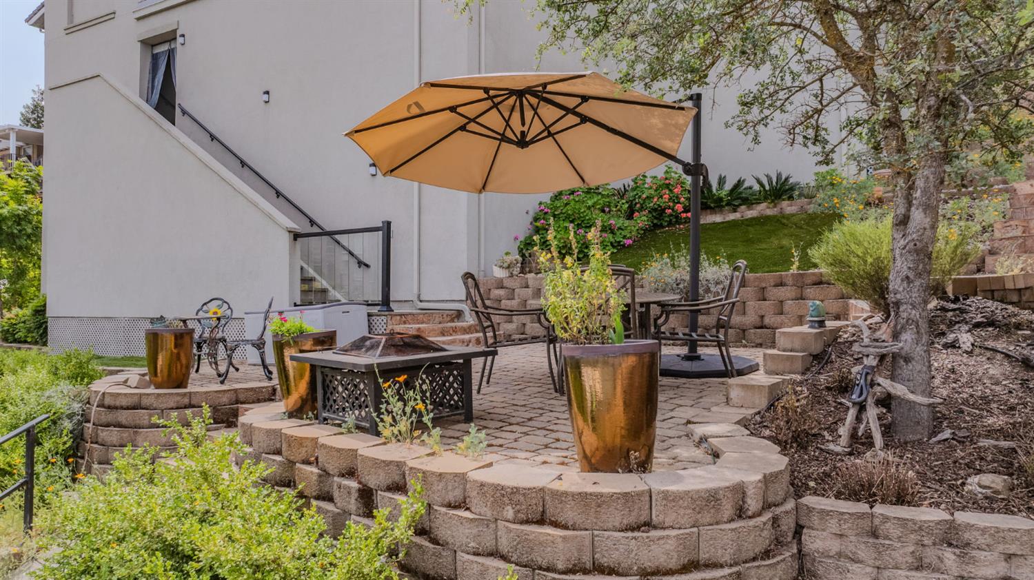 6066 Bluff View Road Copperopolis, CA 95228 - Photo 75 of 96 a view of a patio with table and chairs potted plants