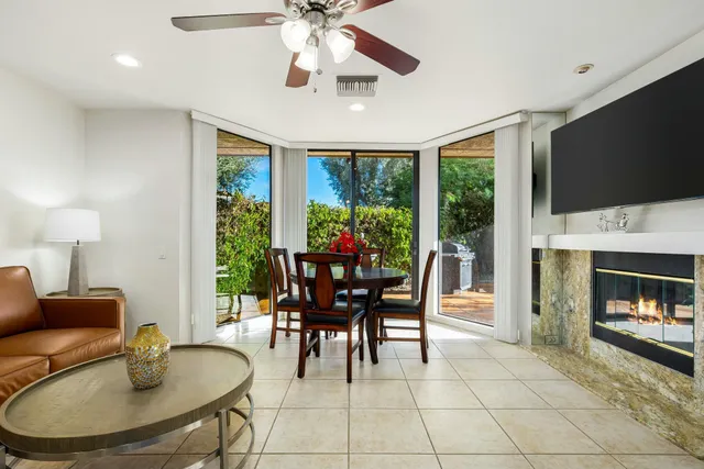 a dining room with furniture garden view and a fireplace