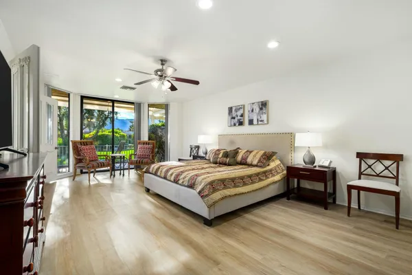 a bedroom with a bed and a table