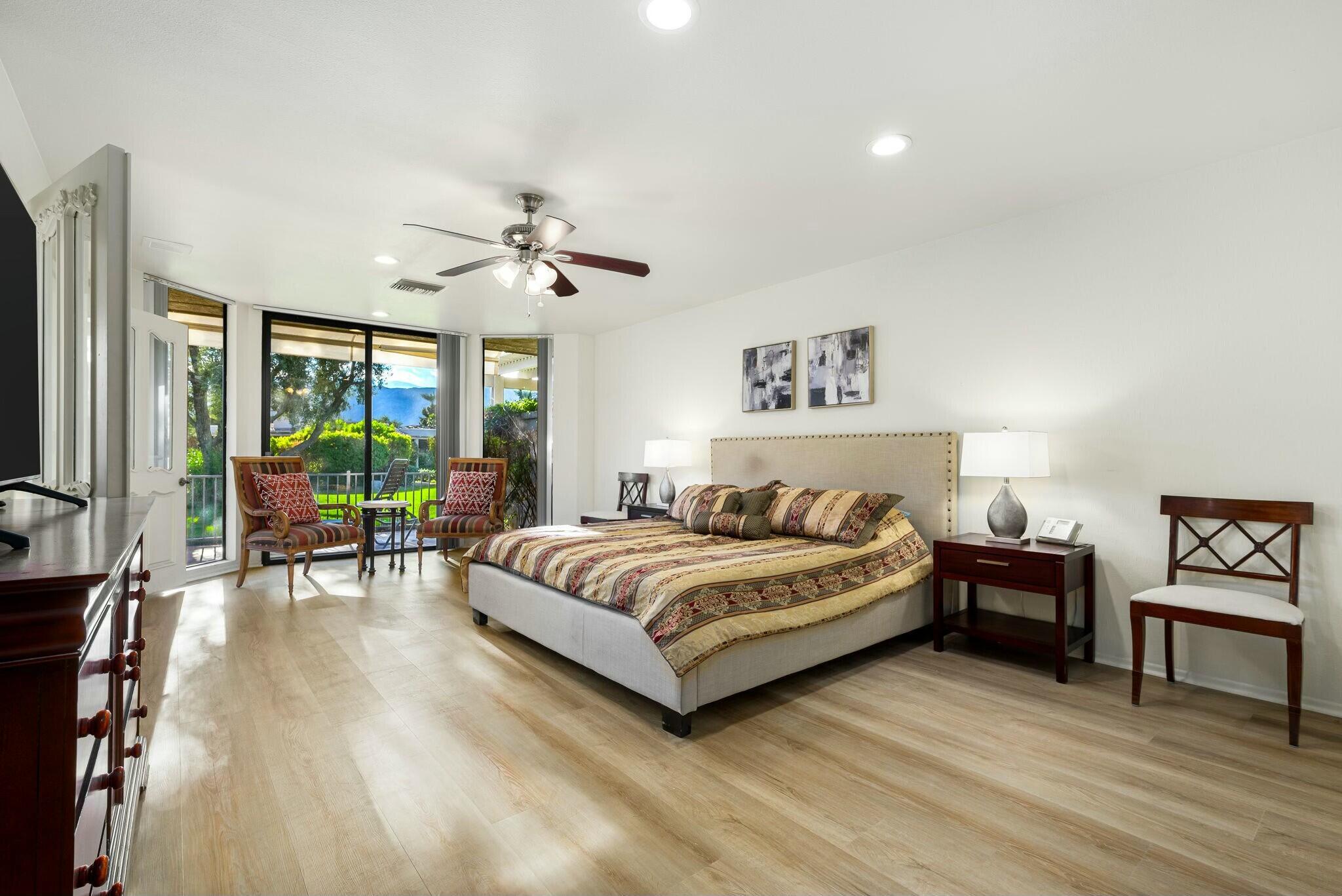 6 Stanford Drive Rancho Mirage, CA 92270 - Photo 19 of 39 a bedroom with a bed and a table