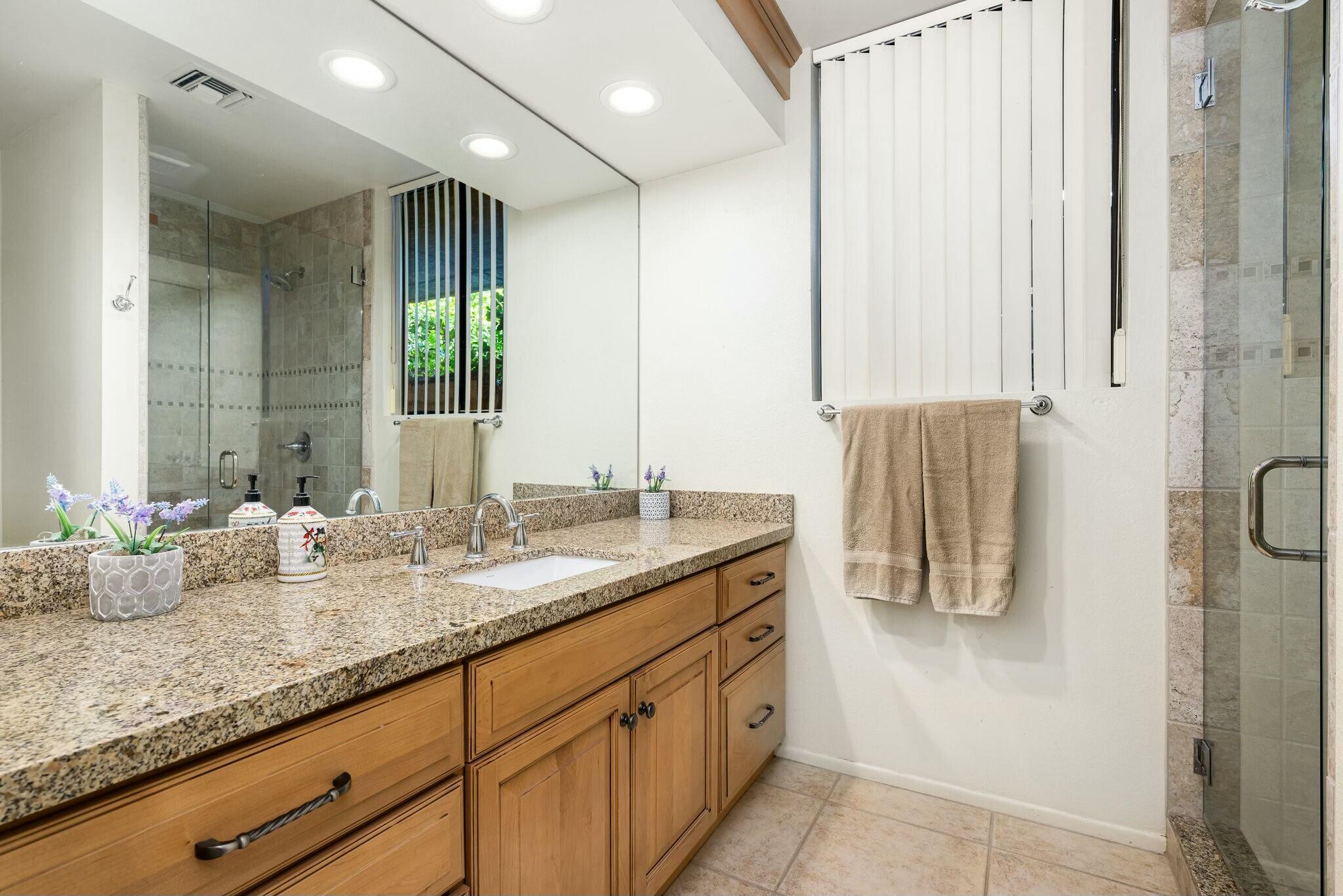 6 Stanford Drive Rancho Mirage, CA 92270 - Photo 29 of 39 a bathroom with double vanity and a mirror