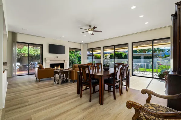 a view of a dining room with furniture window and wooden floor