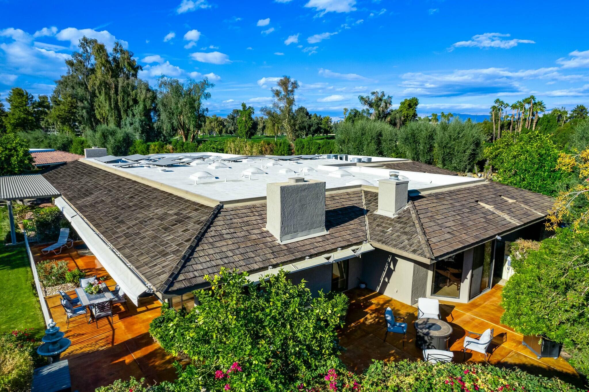 6 Stanford Drive Rancho Mirage, CA 92270 - Photo 34 of 39 an aerial view of a house with a yard
