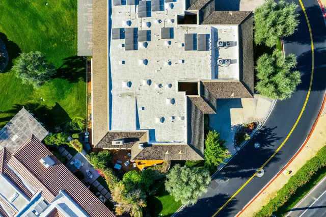 a view of a patio with table and chairs and a yard