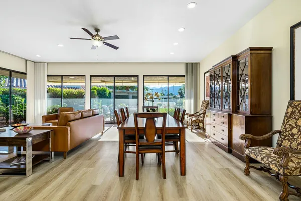 a view of a dining room with furniture window and wooden floor