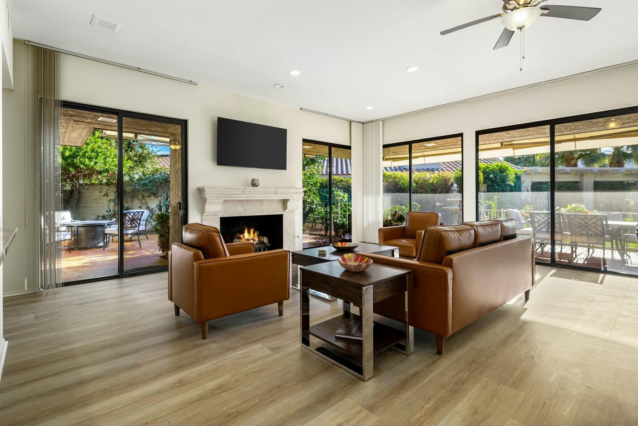 6 Stanford Drive Rancho Mirage, CA 92270 - Photo 6 of 39 a living room with fireplace furniture and a flat screen tv