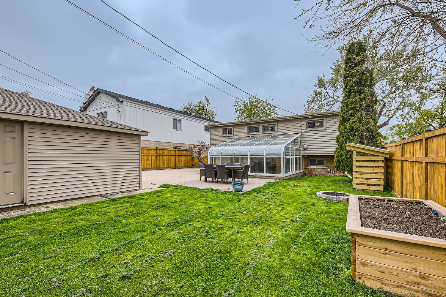 465 Northgate Court Riverside, IL 60546 - Photo 25 of 27 a view of a house with a yard deck and a large tree