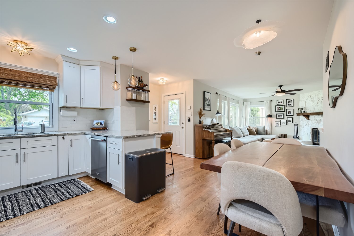 465 Northgate Court Riverside, IL 60546 - Photo 7 of 27 a kitchen with stainless steel appliances granite countertop a refrigerator oven a sink dishwasher a dining table and chairs with wooden floor
