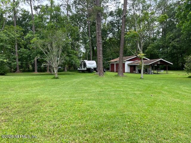 0 Alpha Avenue Jacksonville, FL 32205 - Photo 3 of 3 a front view of a house with a yard