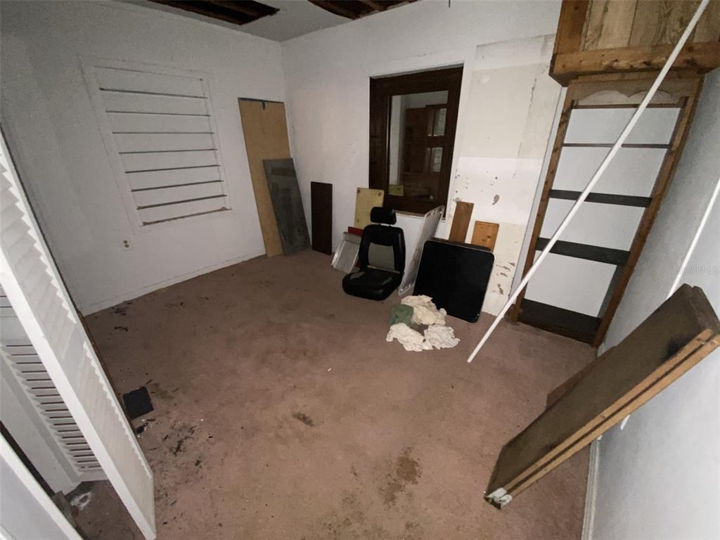 11708 Hills Road Seffner, FL 33584 - Photo 26 of 30 a view of walk in closet with clothes and shoes