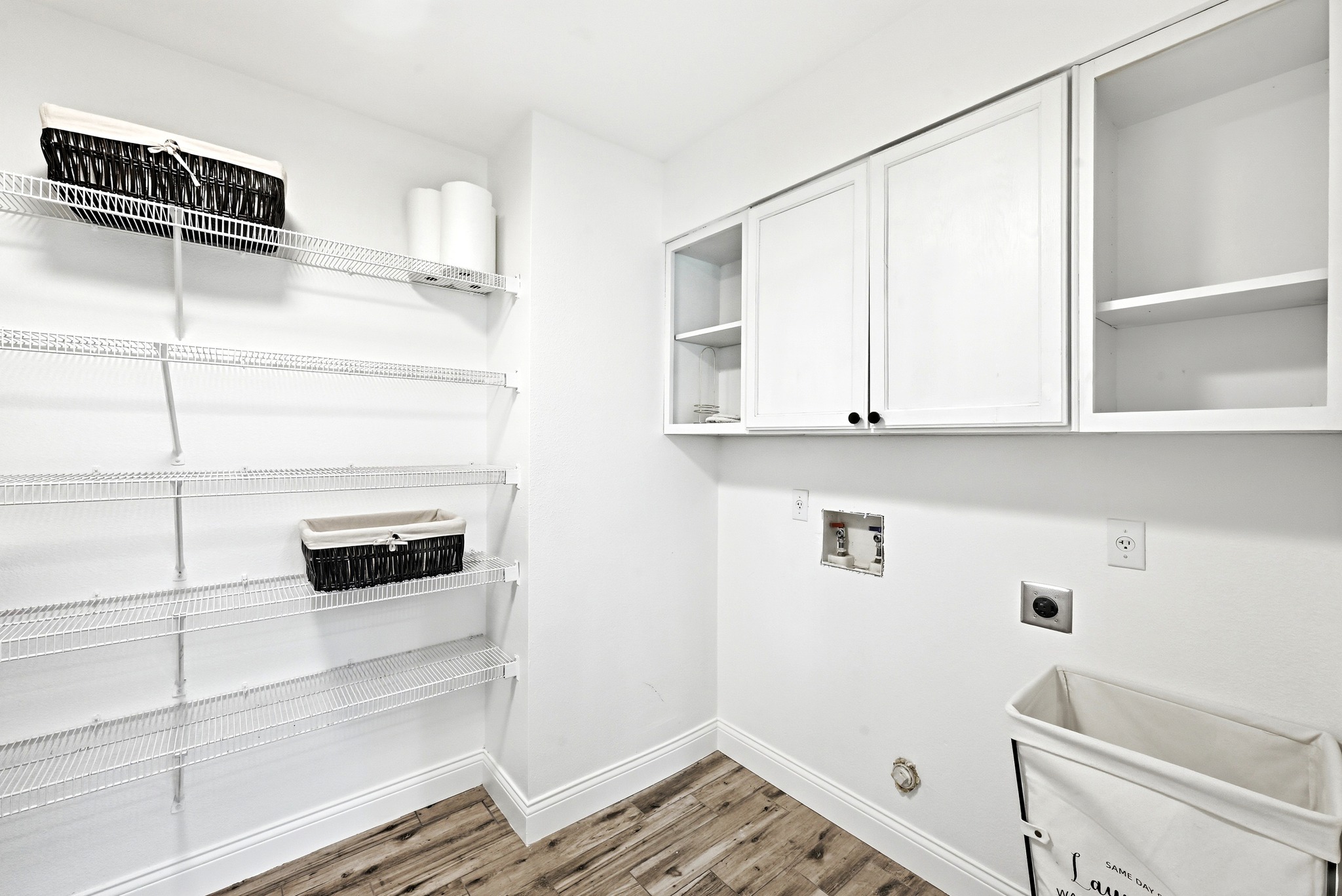 1801 Monks Tale Court Austin, TX 78748 - Photo 11 of 36 Ample shelving and cabinetry create an organized and efficient laundry area.