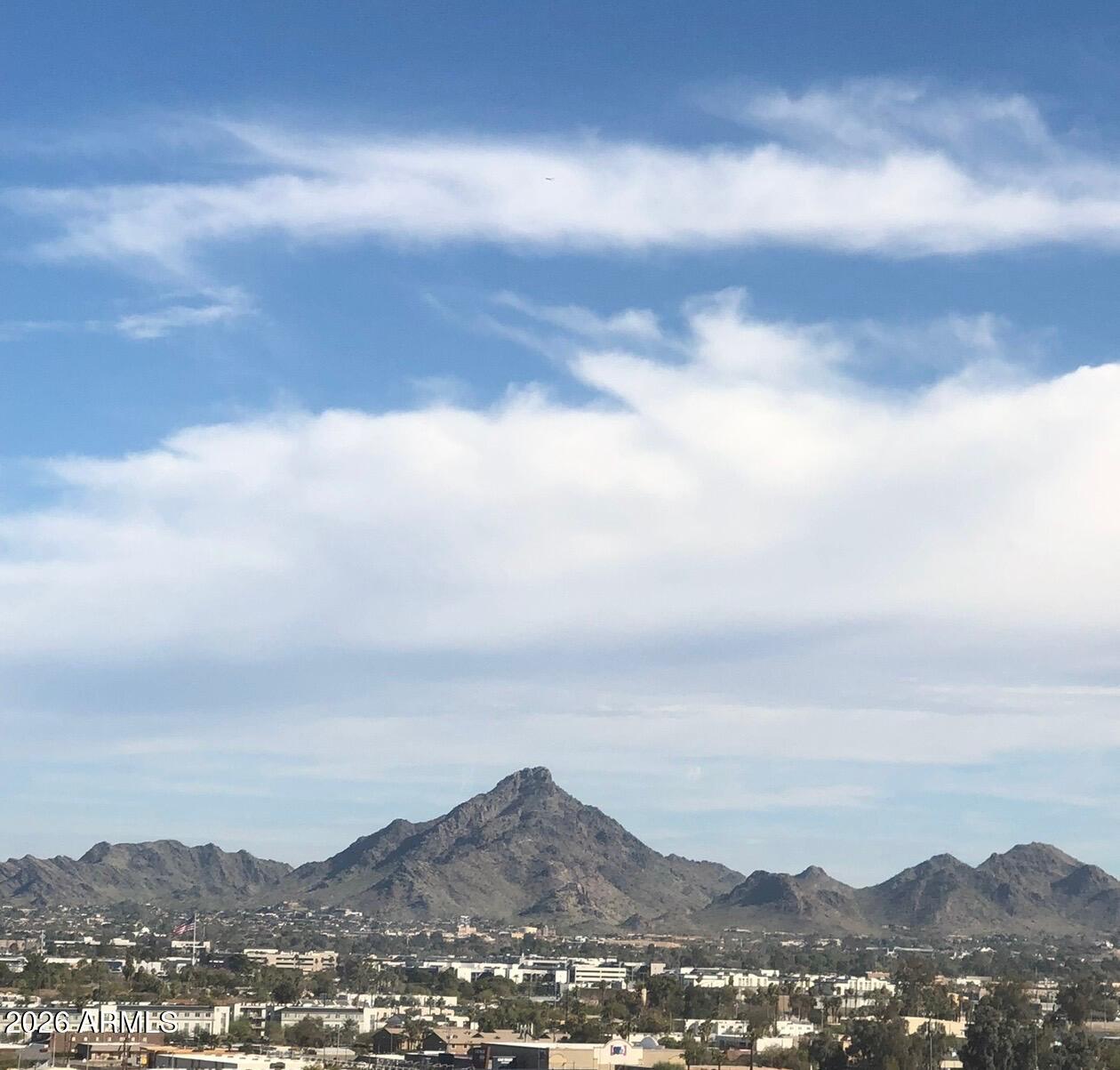 1040 East Osborn Road, Unit 1103 Phoenix, AZ 85014 - Photo 48 of 49 a view of a city with mountains in the background